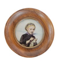 Vintage Round Wooden Framed Wall Art Featuring A Girl Knitting Albert Anker