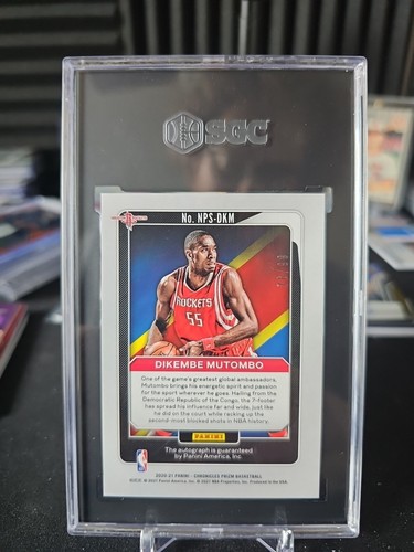 2020-21 Panini Prizm - National Pride Silver Auto Prizm Dikembe Mutombo - Picture 2 of 2