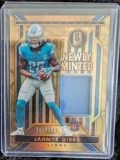2023 Panini Gold Standard - Newly Minted Memorabilia #NM-12 Jahmyr Gibbs 186/399