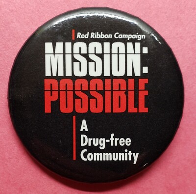 RED RIBBON CAMPAIGN ''A DRUG-FREE COMMUNITY '' MISSION POSSIBLE PINBACK BUTTON PIN