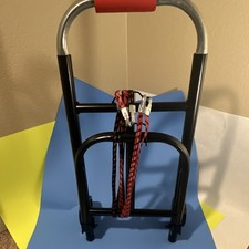 Black Folding Hand Truck with Red Handle and Bungee Cord