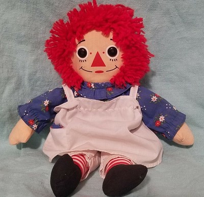 red haired doll with a triangle nose