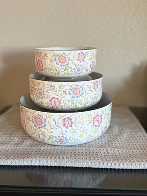vintage Ejiry enamelware stacking bowls featuring a colorful floral pattern