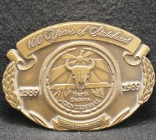XE01123 NOS VINTAGE 1989  NORTH DAKOTA  100 YEARS OF STATEHOOD BELT BUCKLE