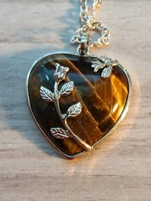 Heart Shaped Pendant With A Silver Necklace