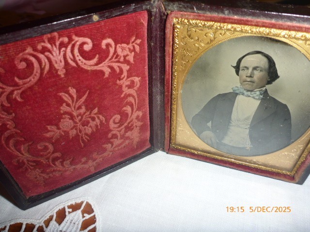 An Antique cased early Daguerreotype photo of a gentleman with pocket watch