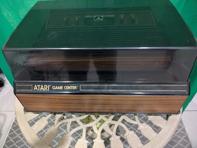original Atari 2600 console with case, joysticks, paddles and 14 games
