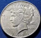 A 1926-D Peace Dollar 90% Silver $1 Dollar.  Nice High Grade