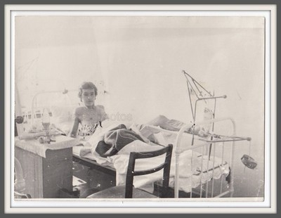 Hospital Broken leg damaged Handsome skinny man 22 yo patient lying in bed photo