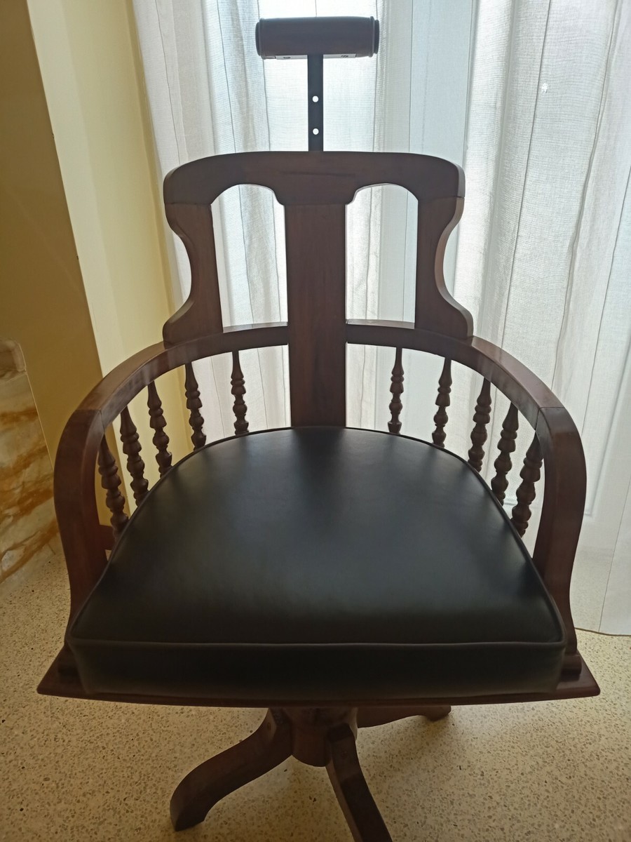 Antica sedia da barbiere