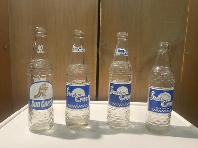 LOT of 4- ALL DIFFERENT and UNIQUE-VINTAGE SUNCREST POP BOTTLES-NO CHIPS/CRACKS