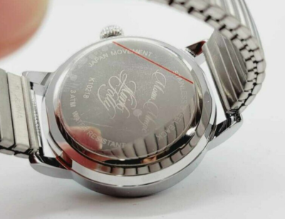 KIRKS FOLLY WATCH SILVERTONE STRETCH BAND BLUE CRESCENT MOON FACE