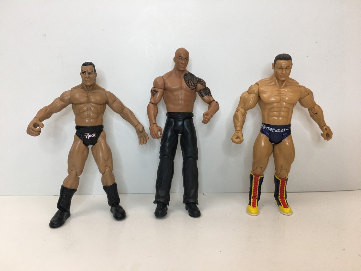 Lot of 3 WWE wrestling action figures Two of The Rock 1999 2011