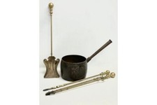 A late Victorian cast iron range saucer by Baldwin 53cm. 3 Victorian brass fire