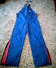 Vintage Carhartt Double-Knee Duck Canvas Bib Overalls In A Distressed navy blue