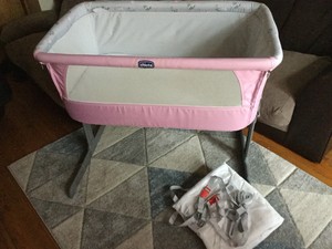 pink chicco next to me crib