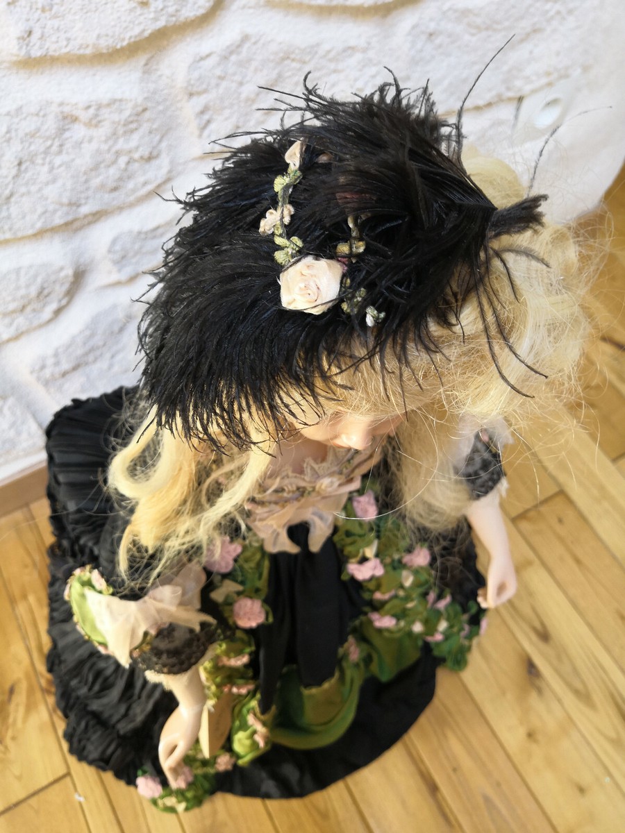An eighteenth century lady with a huge wig topped with a miniature