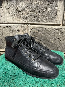 Baskets montantes Gucci en cuir noir Guccissima taille US 7