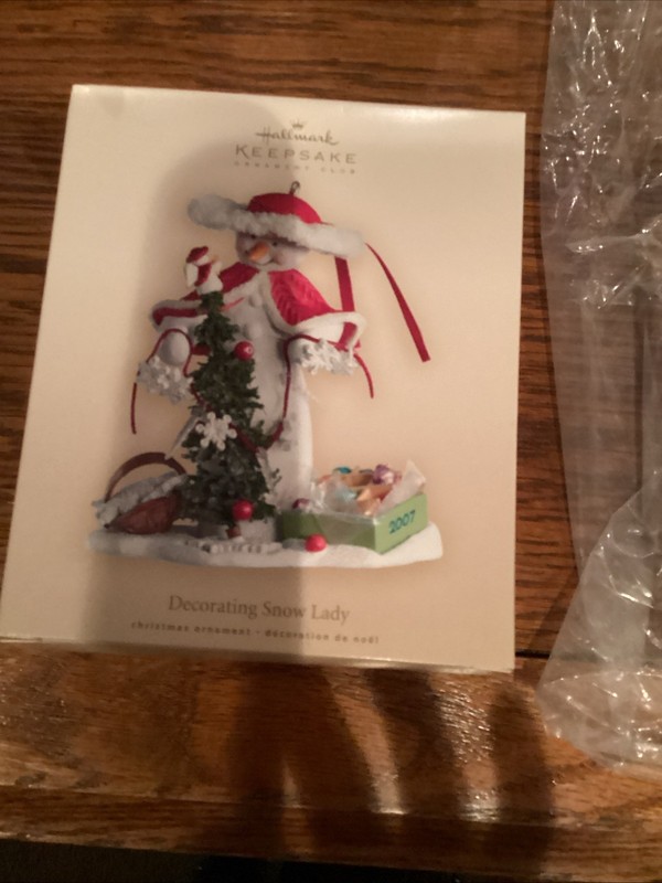 2007 Decorating Snow Lady Hallmark Ornament - Snowman with Christmas Tree - NEW!