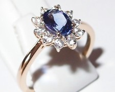 Stunning AA Tanzanite ring, in 14k Yellow Gold with natural Zircon. Size N.
