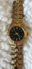 Vintage Seiko 7N82-ODTO watch with diamonds around black face.