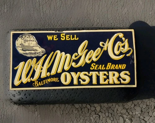 Vintage WE SELL WH McGEE BALTIMORE OYSTERS SEAL BRAND Metal TACKER SIGN OYSTER
