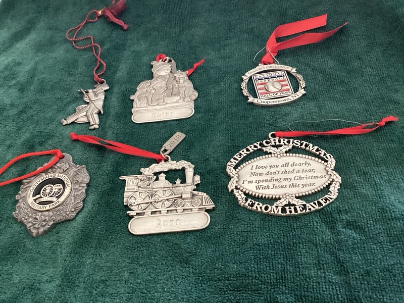 Collection Of Pewter Christmas Ornaments With Various Designs