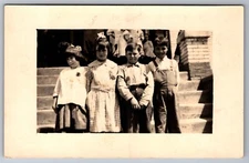 RPPC Postcard Classmates Gathered on Steps Front of School Unp. AZO 1904/18  F6