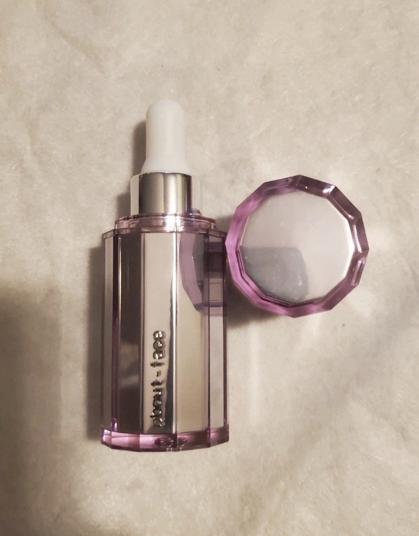 About - Face Light Lock Highlight Fluid- Shade: Fight or Flight. *NWOB 
