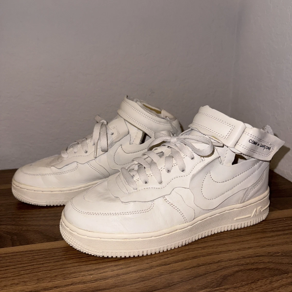Preços baixos em Nike Comme des Garçons x Air Force 1 Mid Triple