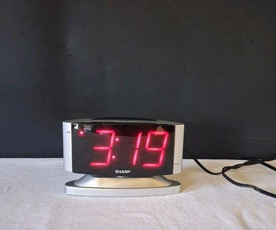 Sharp LED Digital Alarm Clock Swivel Base Silver Case Red Display Model SPC033