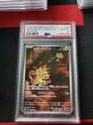 Team Rocket's Meowth 109/098 Sv10: The Glory of Team Rocket Holo PSA 10