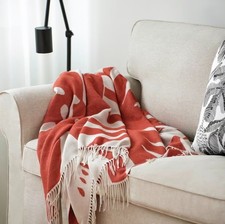 Ikea HYLSNEJLIKA throw, orange/floral pattern...