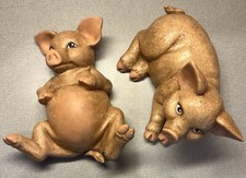 2 Cute Little Ceramic Pigs. One Wants His Belly Rubbed 