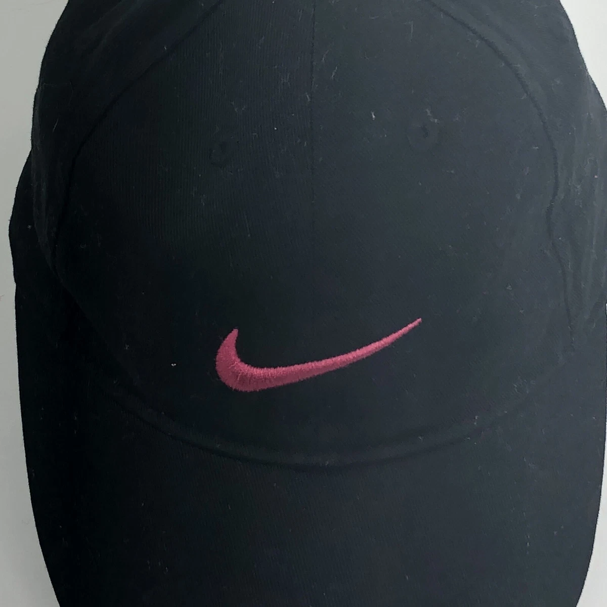 Pink and top black nike hat