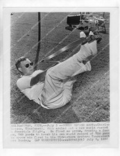 o63517 1955 orig sports archery Charles Pierson using foot bow launches 768 yard