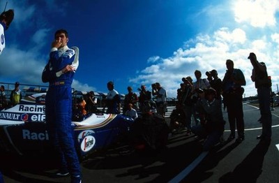 Damon Hill collects his thoughts before the race while the media l- Old Photo