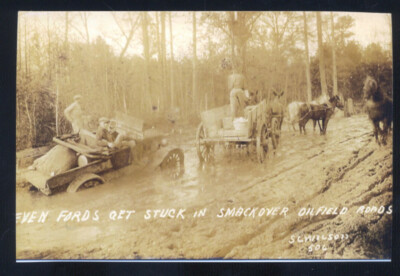 REAL PHOTO SMACKOVER ARKANSAS OIL FIELD CARS TRUCKS IN MUD POSTCARD COPY