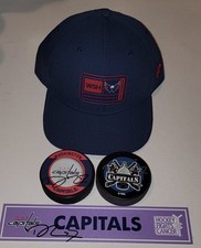 Trevor Van Riemsdyk Signed Nameplate, Two Signed Pucks, And Training Camp Hat