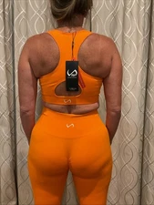 TLF Apparel Women's Neon Orange Burst Fitted Legging And Sports Bra Small NWT