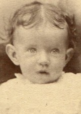 BABY WITH MESSY HAIR AND POUTY EXPRESSION. CDV. MILFORD.