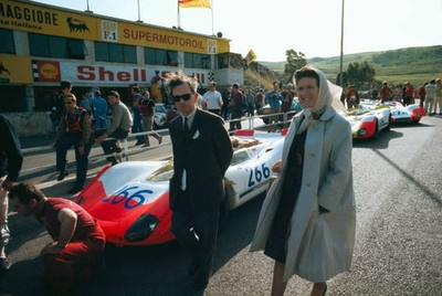 Ferry Porsche his wife Dorothea walking through the pits at Cerda- 1969 Photo