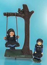 Vintage Cast Iron Hand Painted Amish Girl on Tree Swing Standing Girl Figurine
