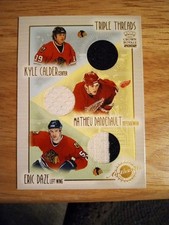 2002 Crown Royale Triple Threads Kyle Calder,Mathieu Dandenault, Eric Daze(MEM)