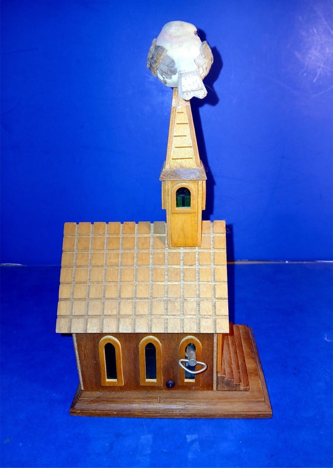 A used wooden church-shaped music box playing Amazing Grace with a spinning bird — pure cottagecore charm at a very approachable price.