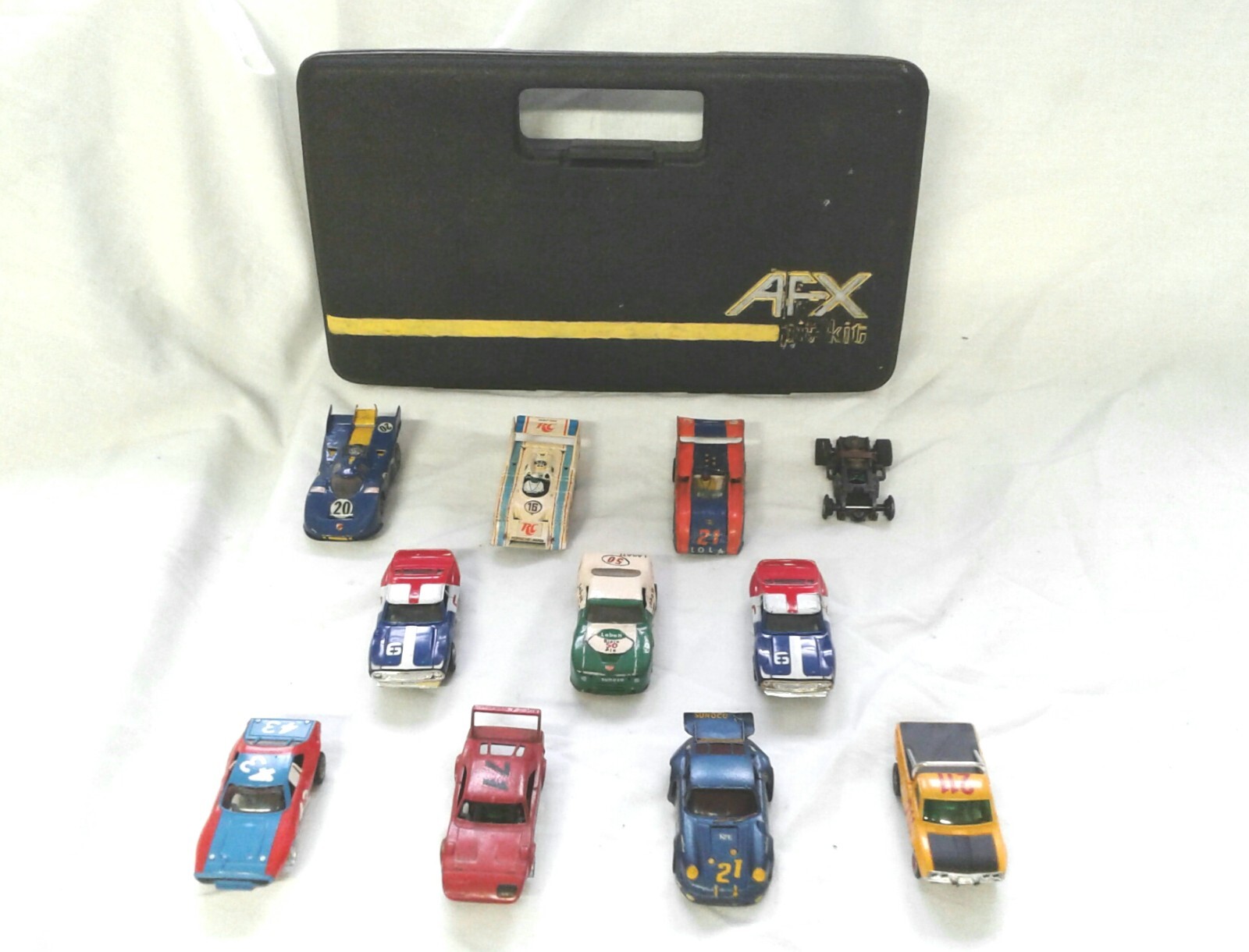 Lot of Vintage Aurora A/FX slot cars, travel case, transformers