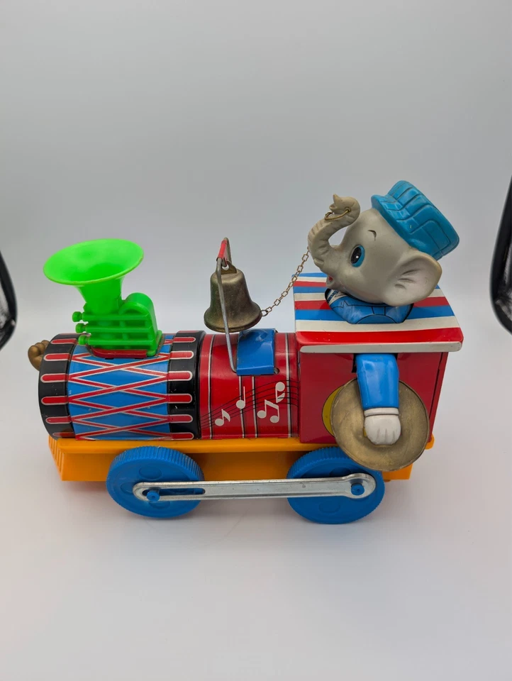 Juguetes modernos de colección litografía de hojalata y plástico elefante loco músico tren motor Foto 3 de 4
