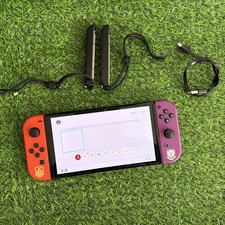 Nintendo Switch OLED , pokemon  Joycons, 64GB with straps
