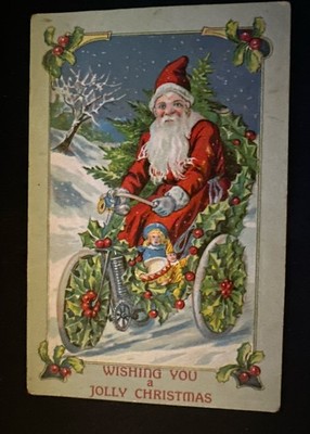 Santa Claus on Motorcycle with Holly~Doll~ 1910~ Embossed Christmas Postcard-r91