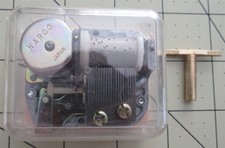 Vintage Wind Up Music Box Movement Plays "Put On A Happy Face" with Key